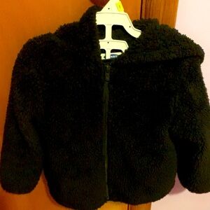 All black, fuzzy jacket, with a hood from Old Navy